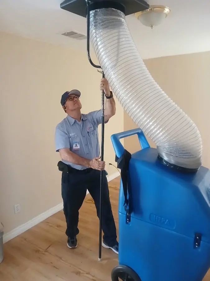 Furnace Tune-Up technician using HEPA equipment in Chesterfield